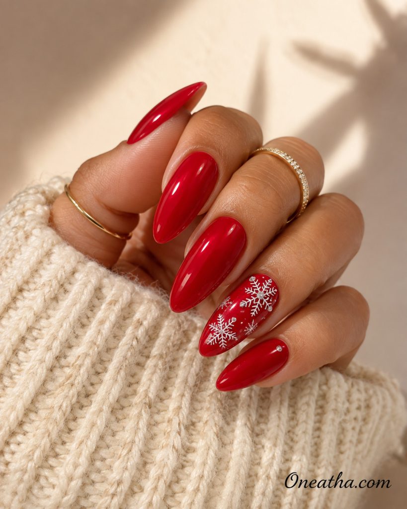 Glossy red Christmas nails with snowflakes by Oneatha.