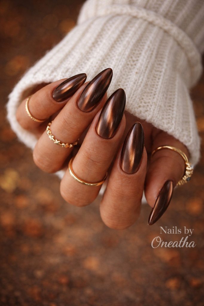 Brown cat eye nails by Oneatha.