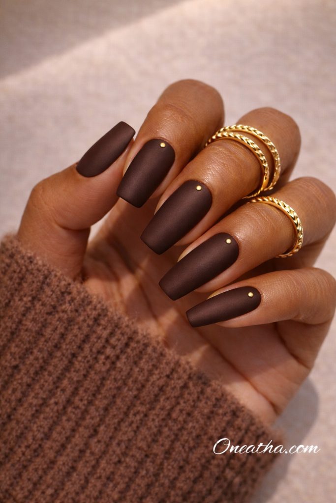 Dark brown matte nails by Oneatha.