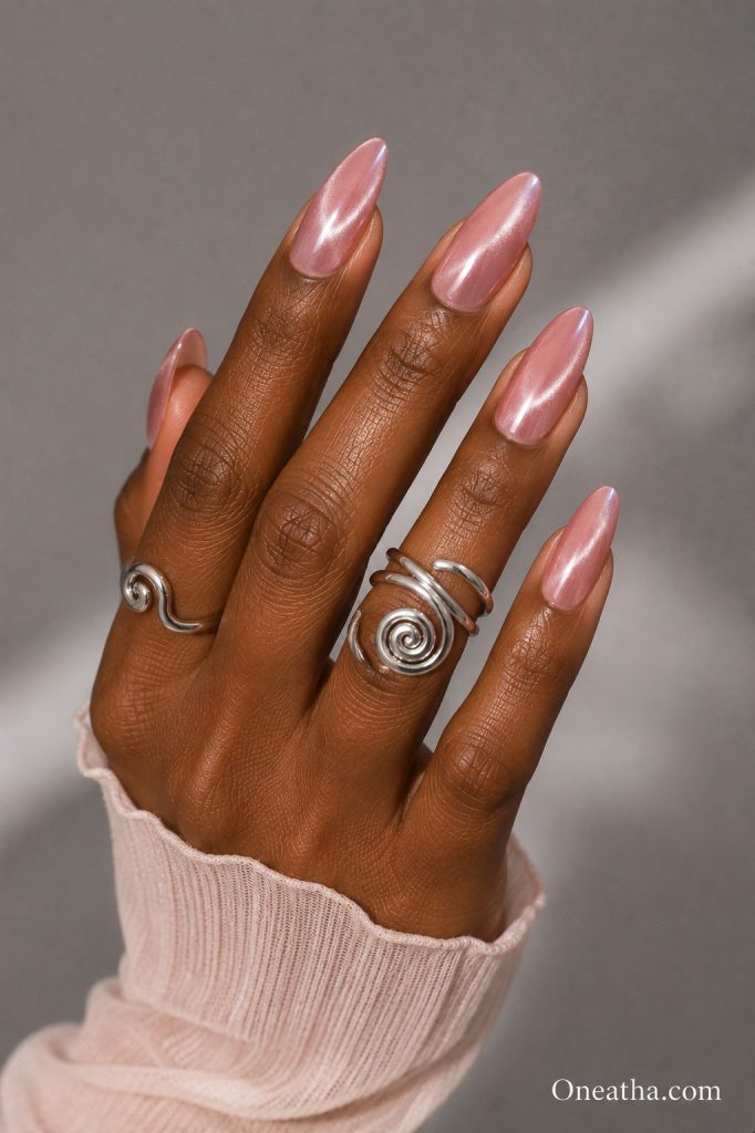 Pink cat eye nails by Oneatha.